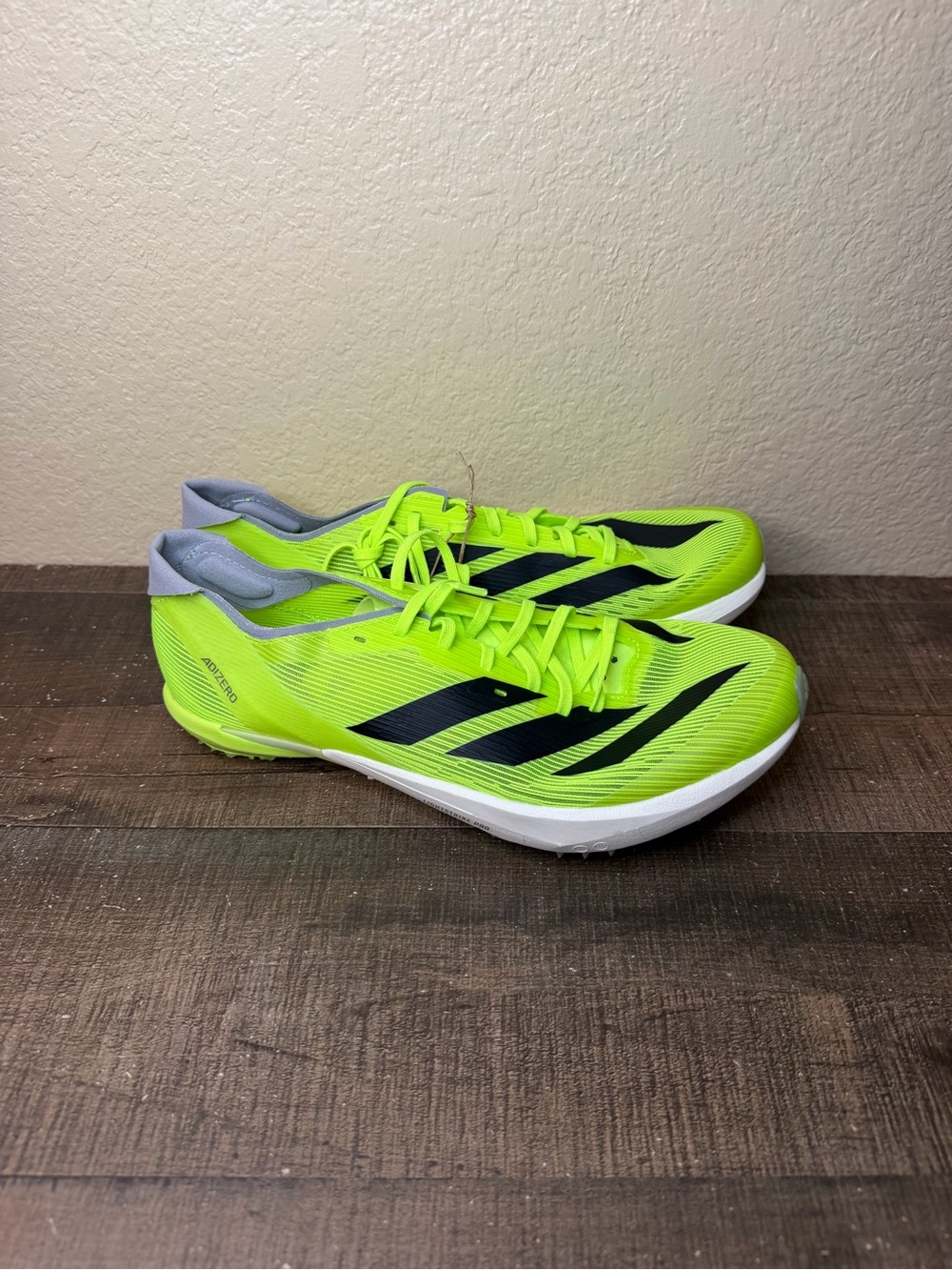 adidas Adizero Ambition “Lucid Lemon” Running Spikes.
- Size 8 Men / 9 Women.